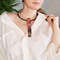 wooden long pendant choker on a girl