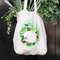 hand-holding-white-grocery-bag-filled-with-leafy-vegetables.jpg