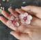 earrings with flowers Sakura in hand