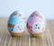Easter wooden painted blue and pink eggs with a baby bunny