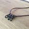 Scavenged-steel-pendant-on-faux-leather-cord