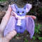 Purple-Bat-plush-in-the-woods