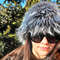 Gray-black fluffy hat. Rave bucket hat. Wolf hat made of faux fur.