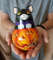 Figurine of a big black cat on a pumpkin , roly poly with a jingle (1).jpg