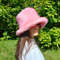 Pink bucket hat made of faux fur. Cute fuzzy bucket hats. Fluffy pink hat.