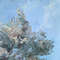 The clear sky visible through the leaves of the tree gives hope and peace. Fragment of a close-up Original Park Painting.