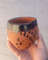 Handmade Moroccan Clay Cup adorned with traditional tar fpaint.JPG