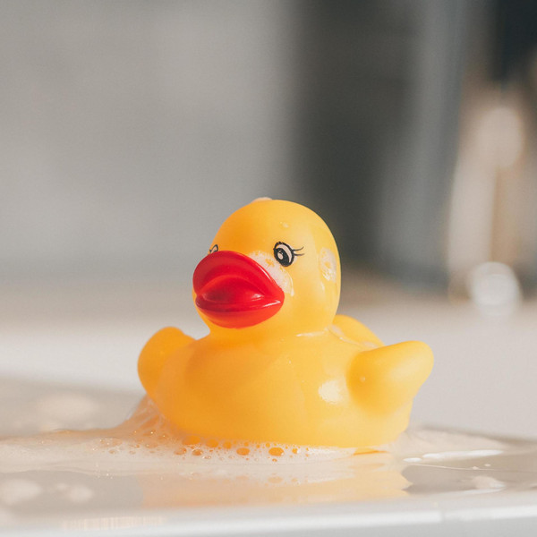 Yellow Rubber Duck For Bath Time Stock Photo - Download Image Now