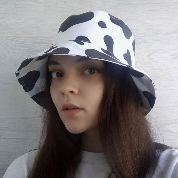 Bucket hat with cow print made of cotton. Fashionable unisex designer hat. Cute animal print hat. Summer hat for travel.