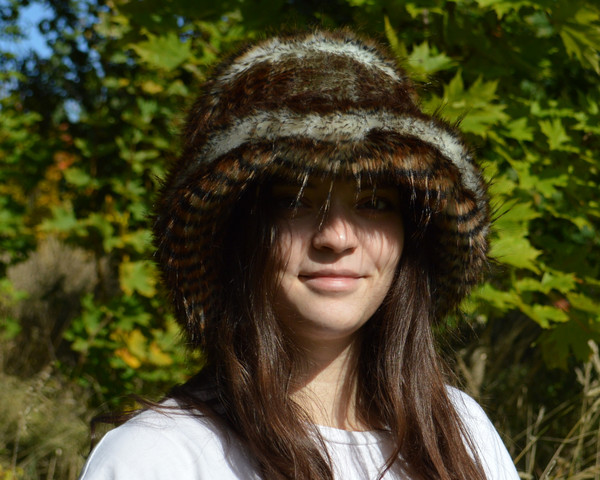 Faux fur hat with animal print. Luxury fashion furry hat. Fluffy bucket hats for women made of raccoon fur. Fuzzy hat.