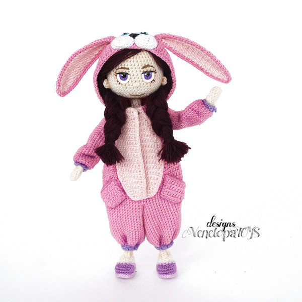 Amigurumi doll in kigurumi costume with cute bunny ears