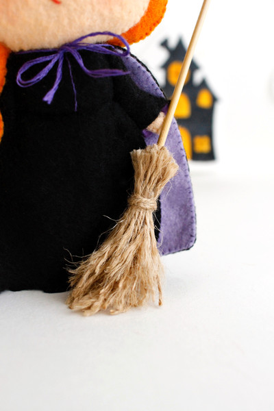Felt witch's broomstick, close-up