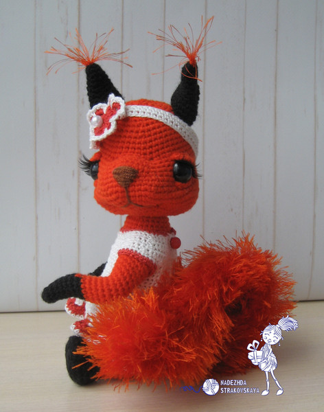 Crocheted Squirrel sitting in clothes