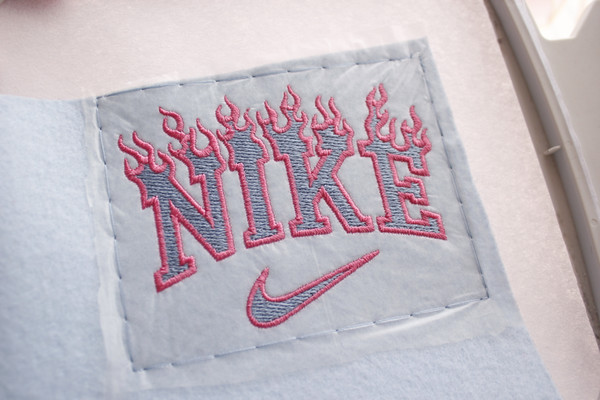 custom burning nike logo machine embroidery design