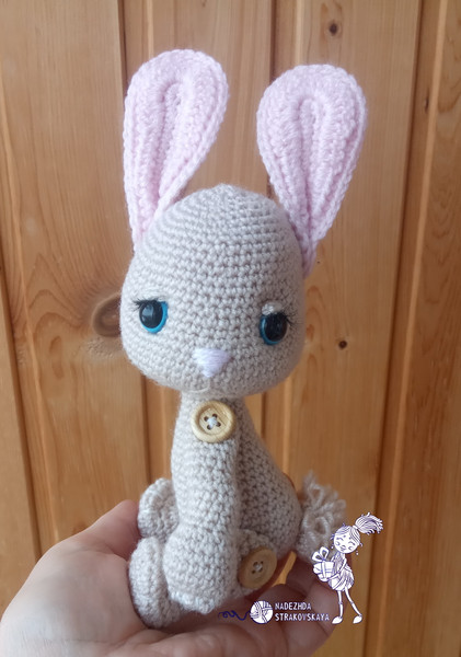 Crocheted Chalky bunny in hand