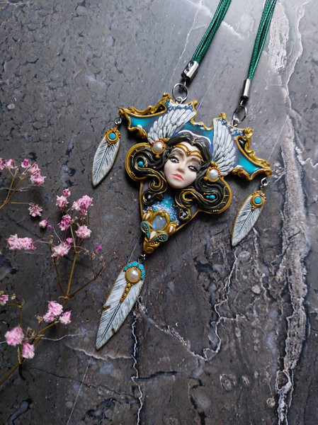 Pendant with a beautiful face of a girl