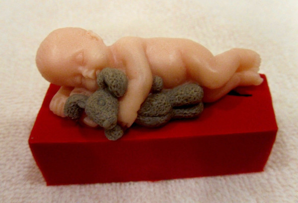 Baby with bunny mold and soap