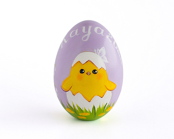 wooden Easter egg with a painted hatched chick