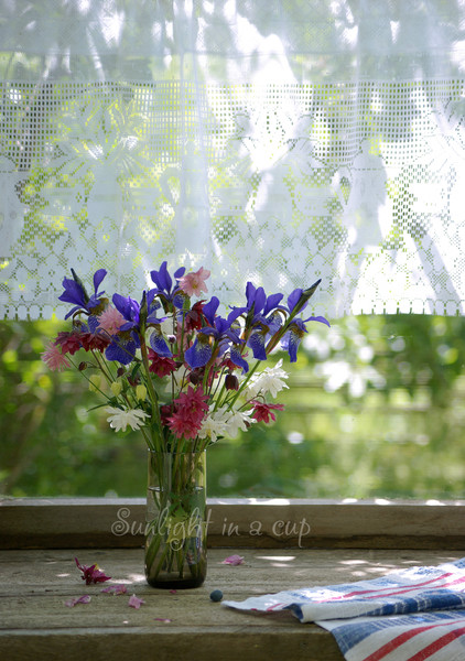 Still life photo with a bouquet of blue irises