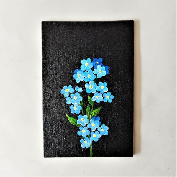 Small-painting-of-wildflowers-forget-me-not-wall-art-on-black-canvas-wall-decor.jpg