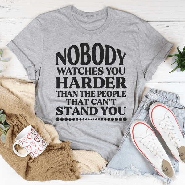 nobody-watches-you-harder-than-the-people-that-can-t-stand-you-tee-peachy-sunday-t-shirt