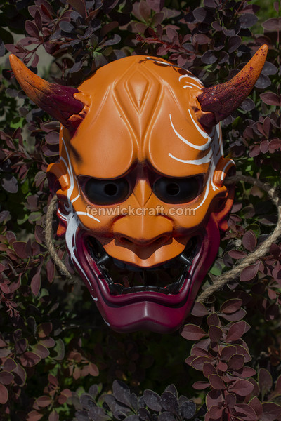 traditional orange japanese oni mask