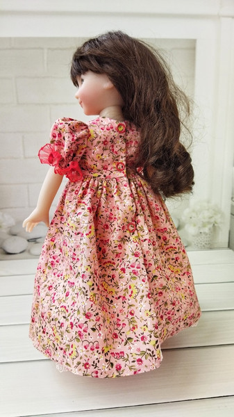 Little Darling floral print smocjed dress with red trim back.jpg