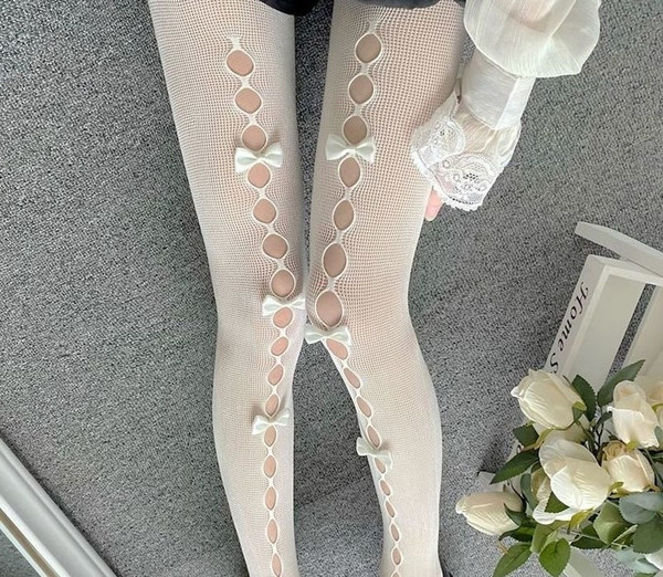 https://www.inspireuplift.com/resizer/?image=https://cdn.inspireuplift.com/uploads/images/seller_products/1680971647_white-tights-bows-holes-fishnet-coqette.jpg&width=600&height=600&quality=90&format=auto&fit=pad