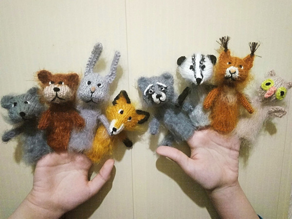 a set of finger puppets in the form of cute forest animals owl, squirrel, raccoon, bear, wolf, badger, raccoon, fox