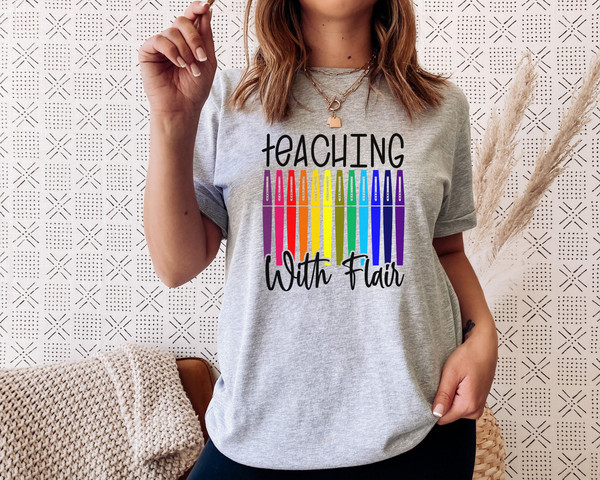 https://www.inspireuplift.com/resizer/?image=https://cdn.inspireuplift.com/uploads/images/seller_products/1688134540_TeachingWithFlairFlairPensTeacherShirtTeacherTeeTeachShirtTeacherT-ShirtsTeacherGiftFunnyTeacherShirtsFlairPenTee-5.jpg&width=600&height=600&quality=90&format=auto&fit=pad