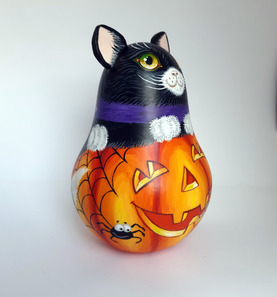 Figurine of a big black cat on a pumpkin , roly poly with a jingle (15).jpg