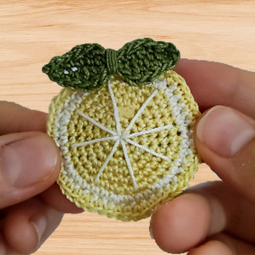 A crochet slice of lemon hair clip pattern