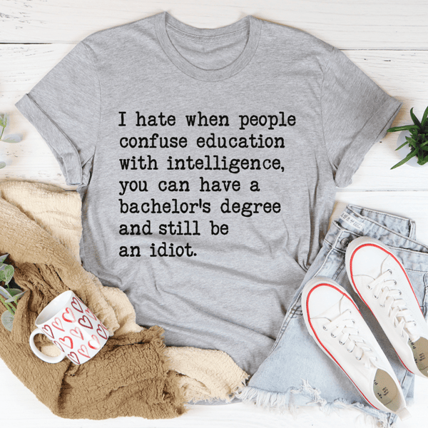 Don't Confuse Education With Intelligence Tee1.png