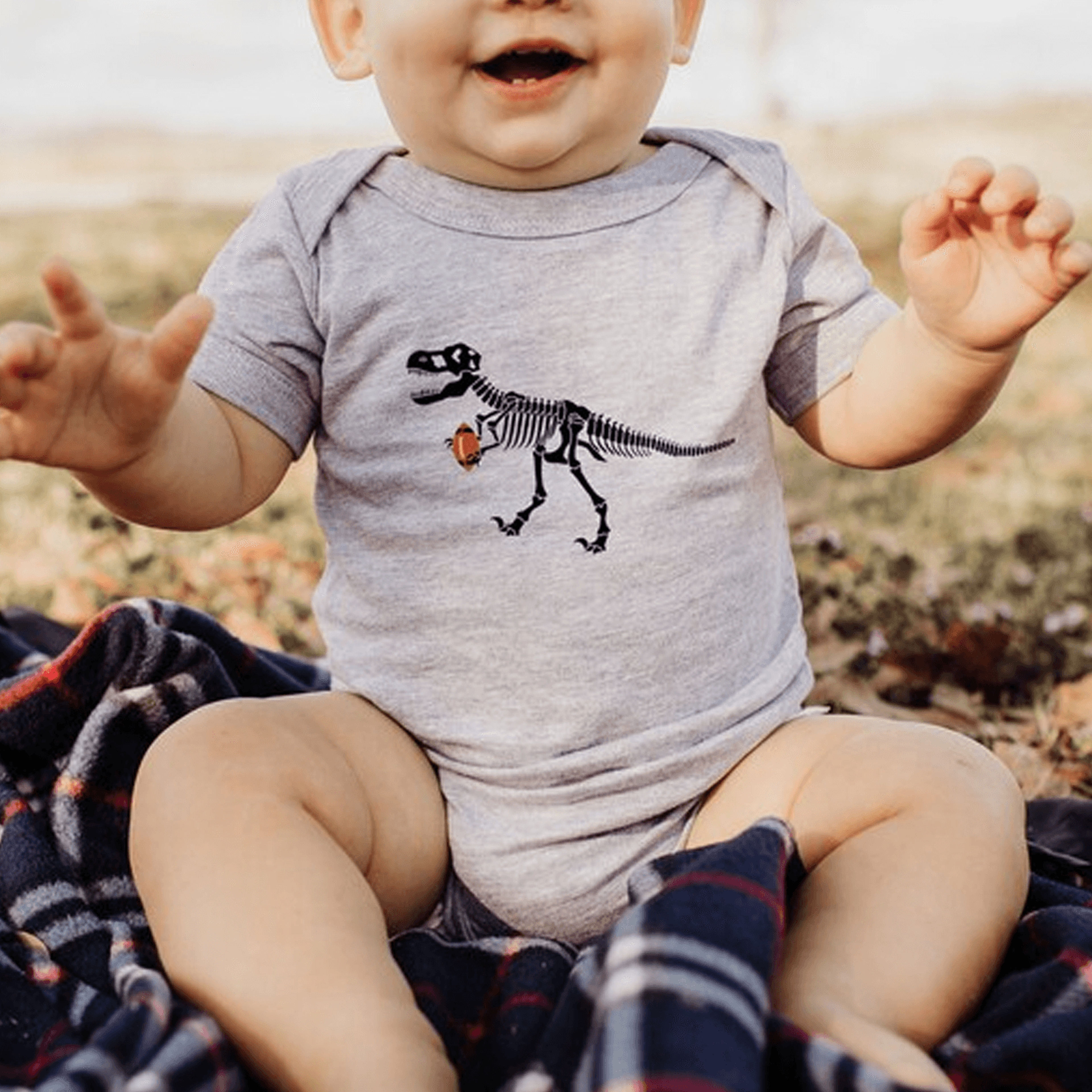 dino skeleton football baby bodysuit, organic cotton dinosaur outfit, game day baby shirt, football baby gift