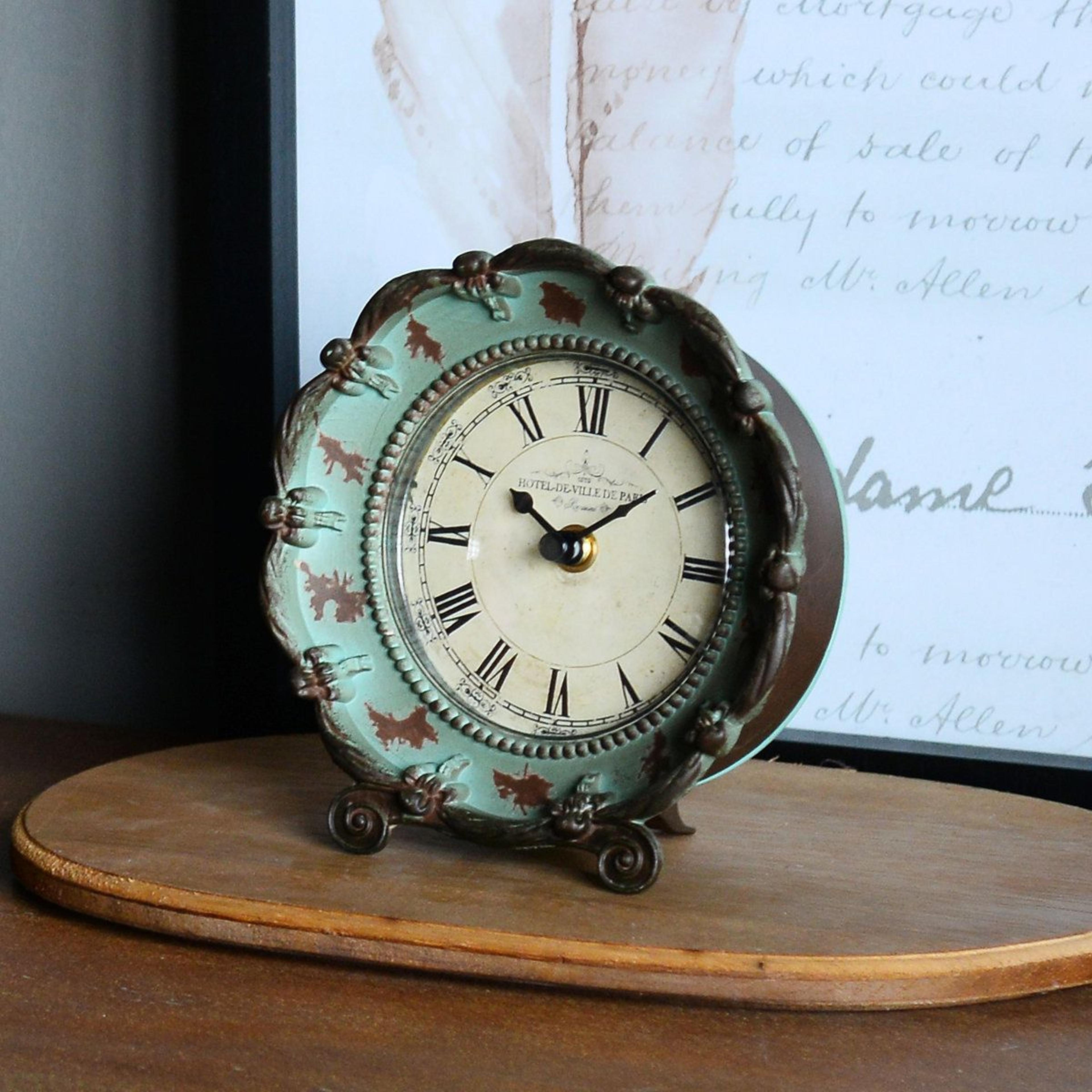 vintage roman numeral tabletop clock with distressed pewter floral frame