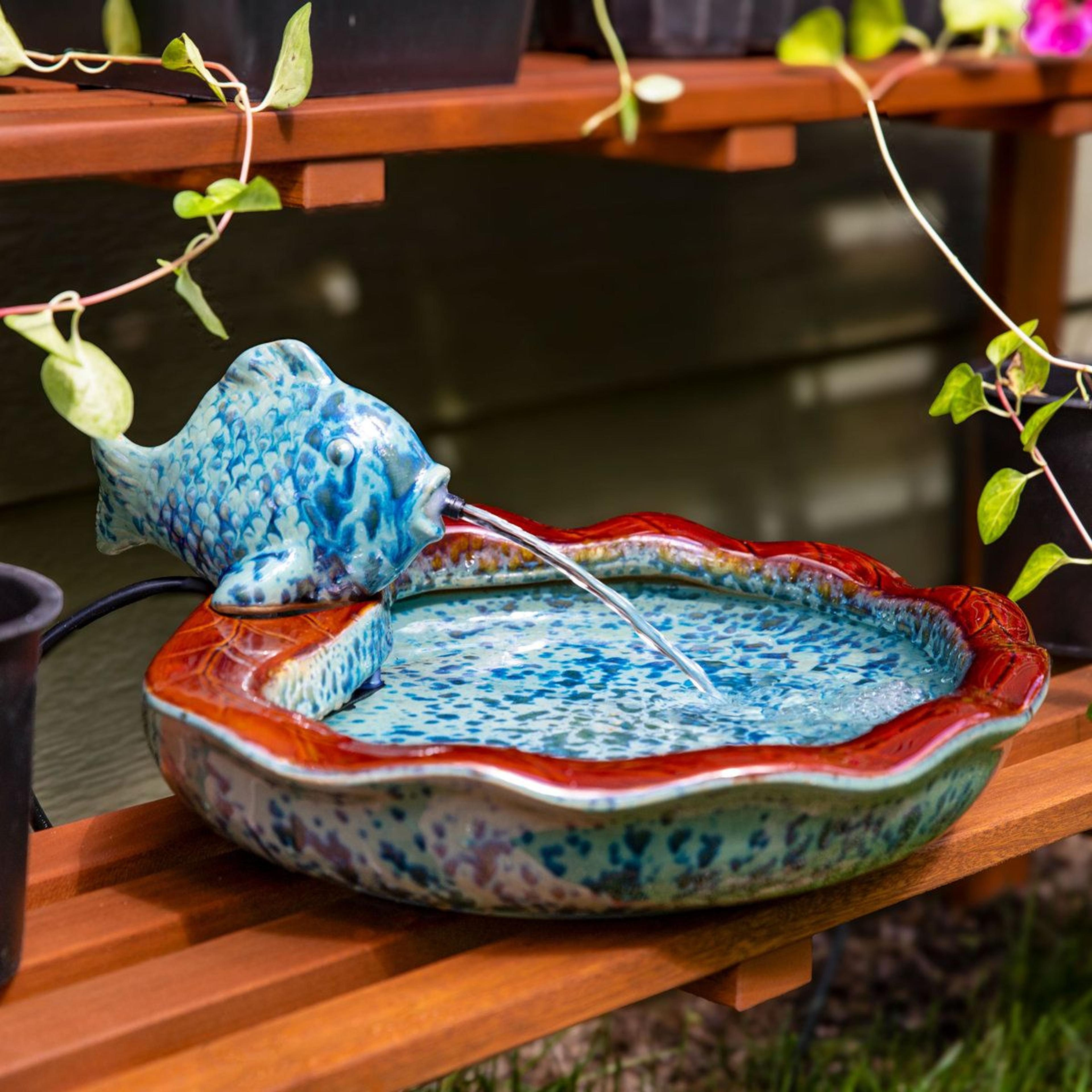 glazed ceramic fish outdoor fountain with soothing water flow and weather resistant finish