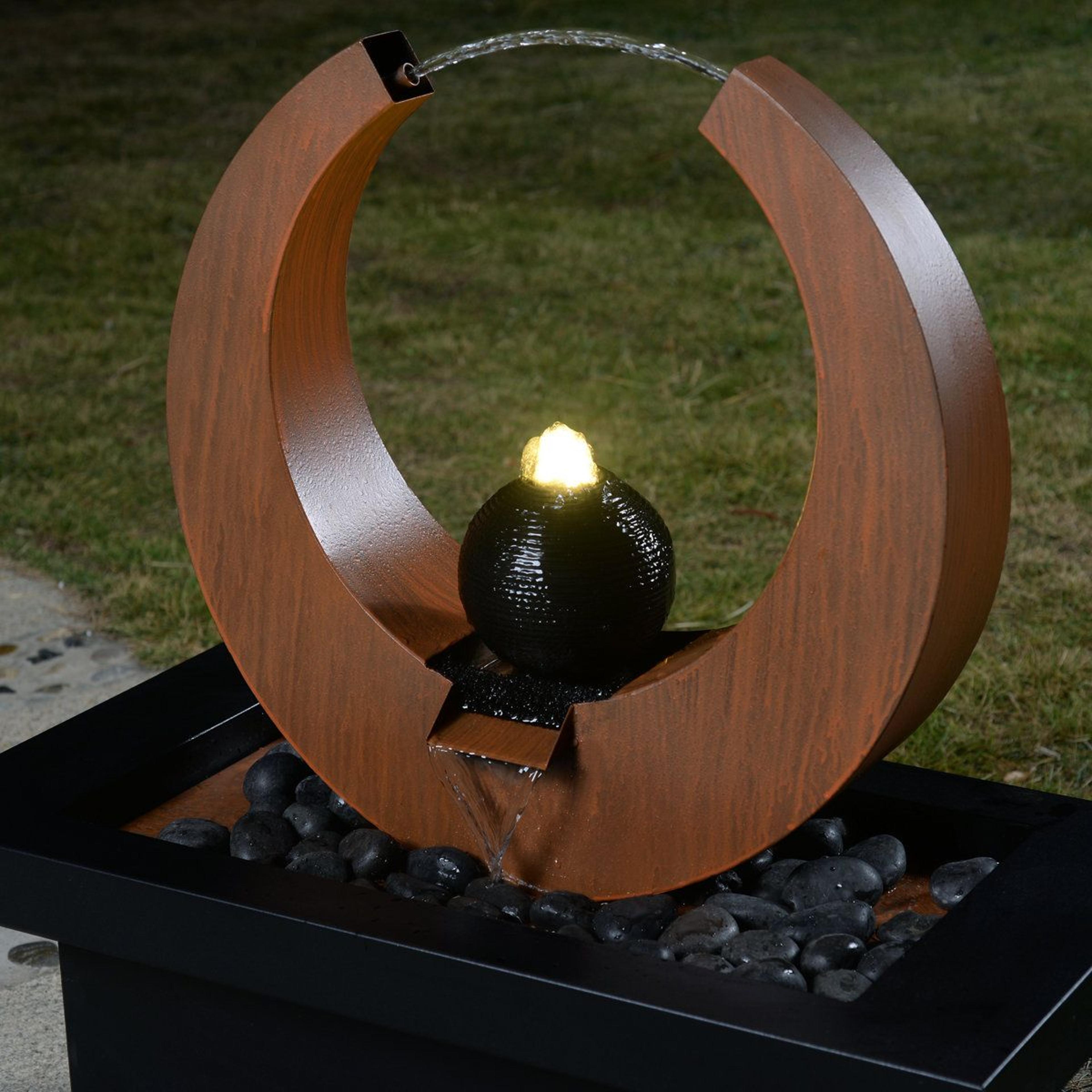 modern outdoor metal fountain with led lights and geometric water feature