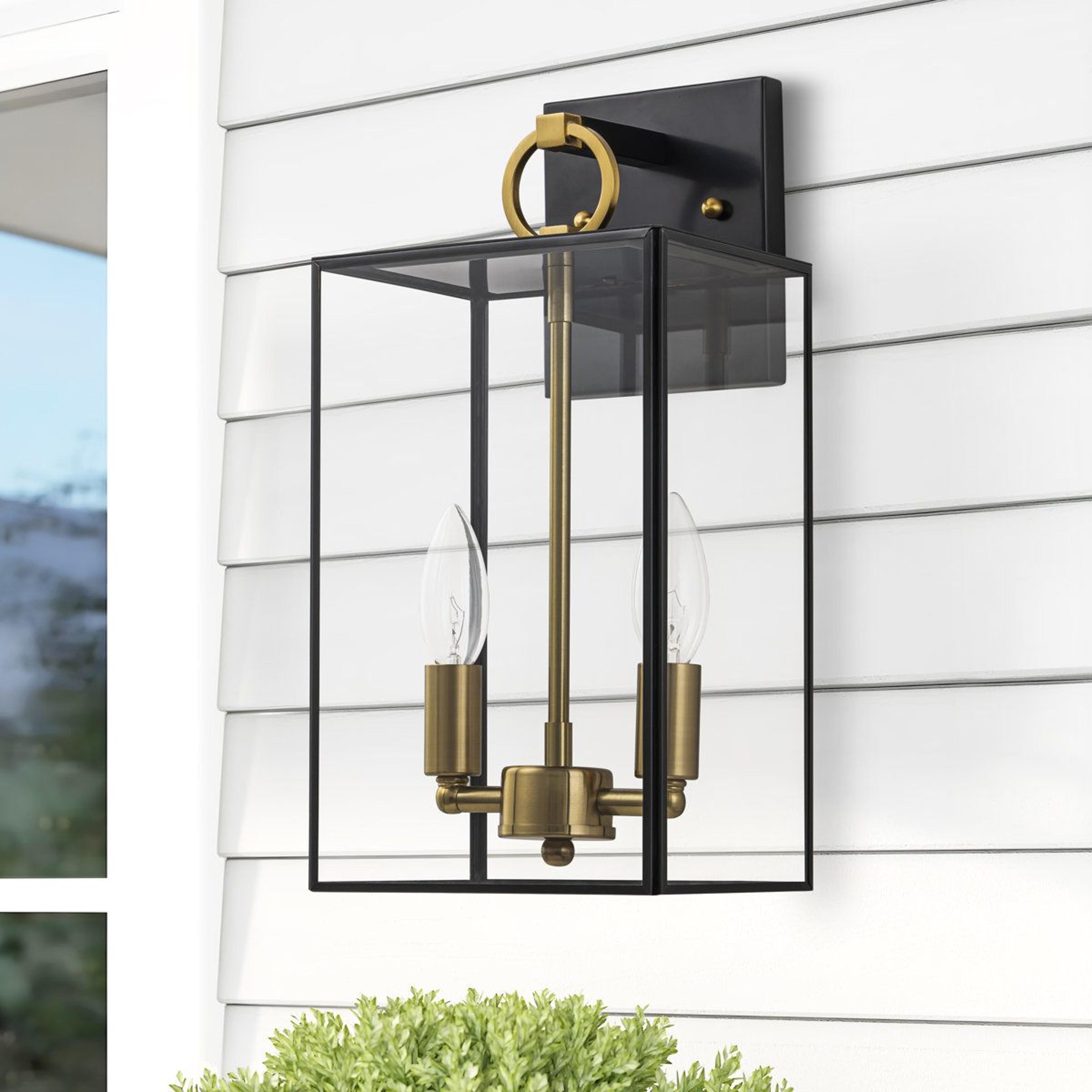 outdoor wall lantern with solid brass accents and clear tempered glass
