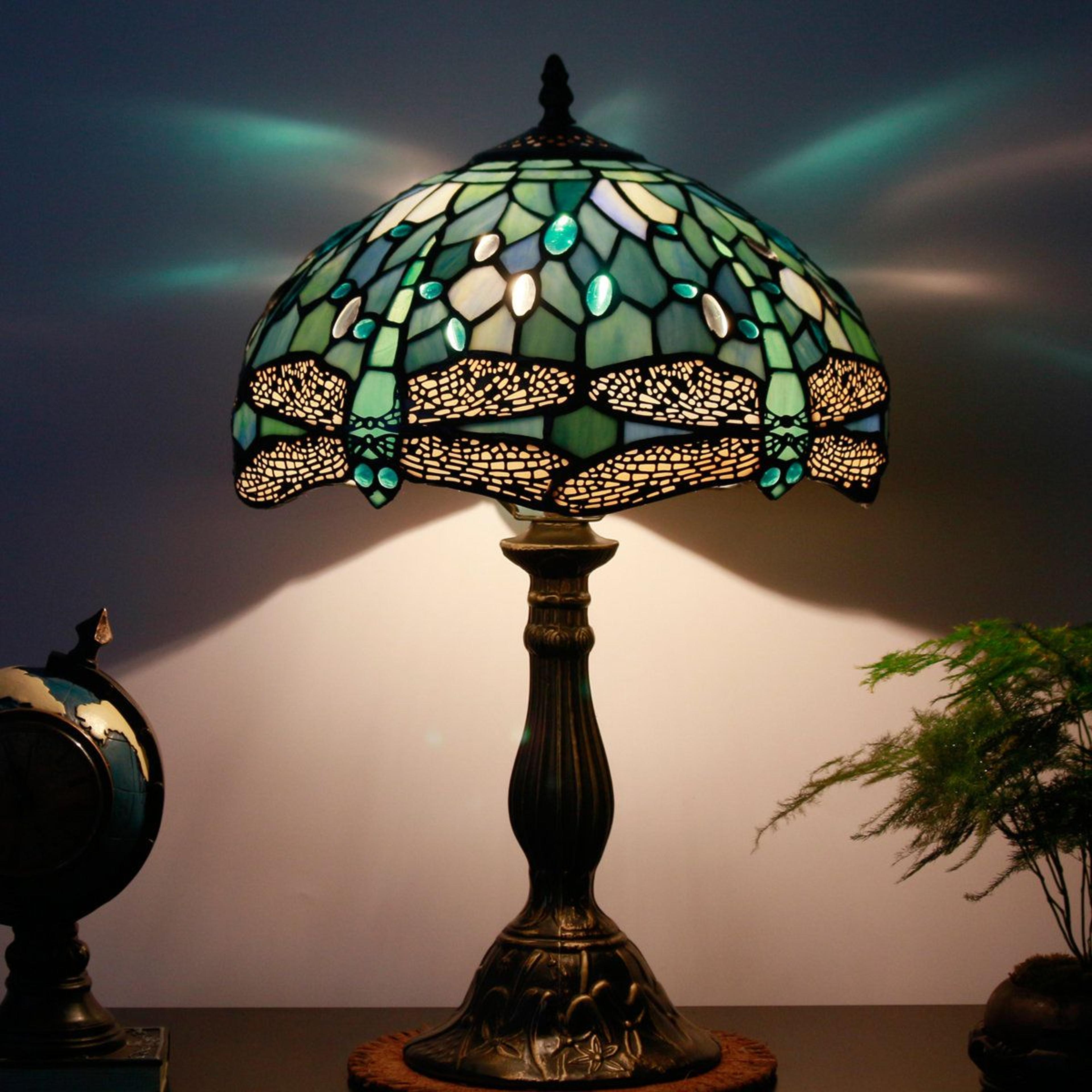 sculptural resin table lamp with bird accents and white linen drum shade 31.25 inch