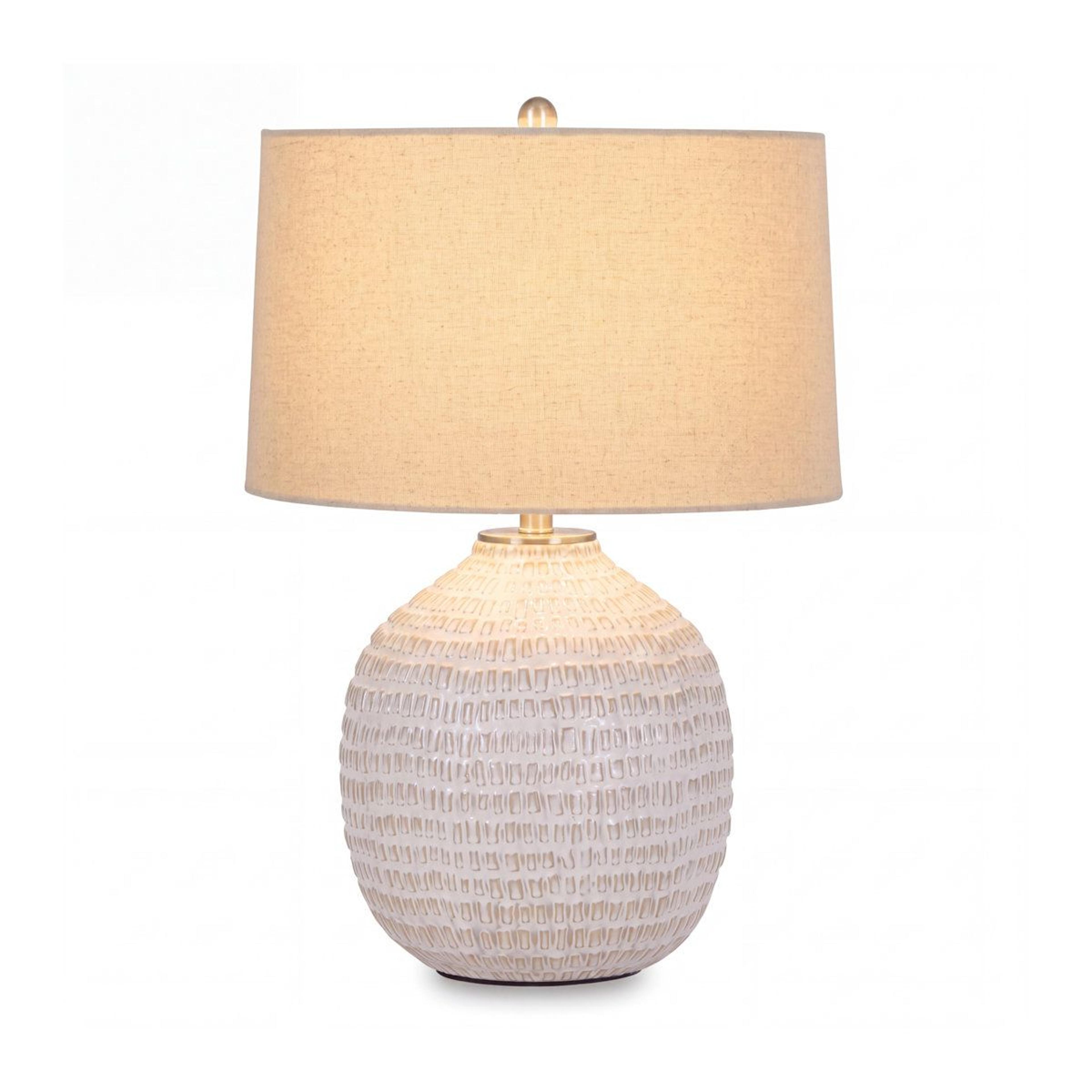 ceramic table lamp with textured base and fabric drum shade