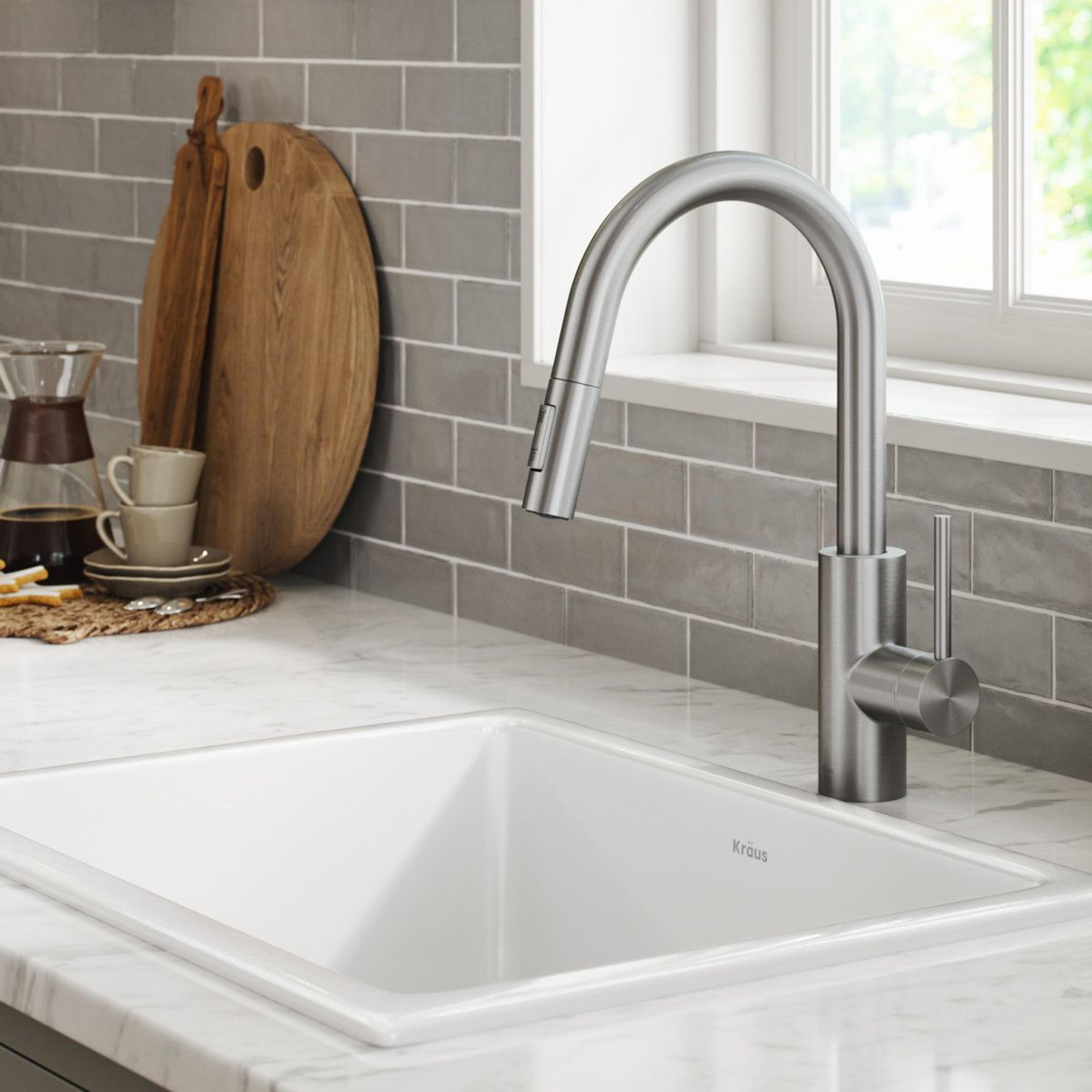 single handle pull down kitchen faucet with quickdock mount and high arc swivel spout