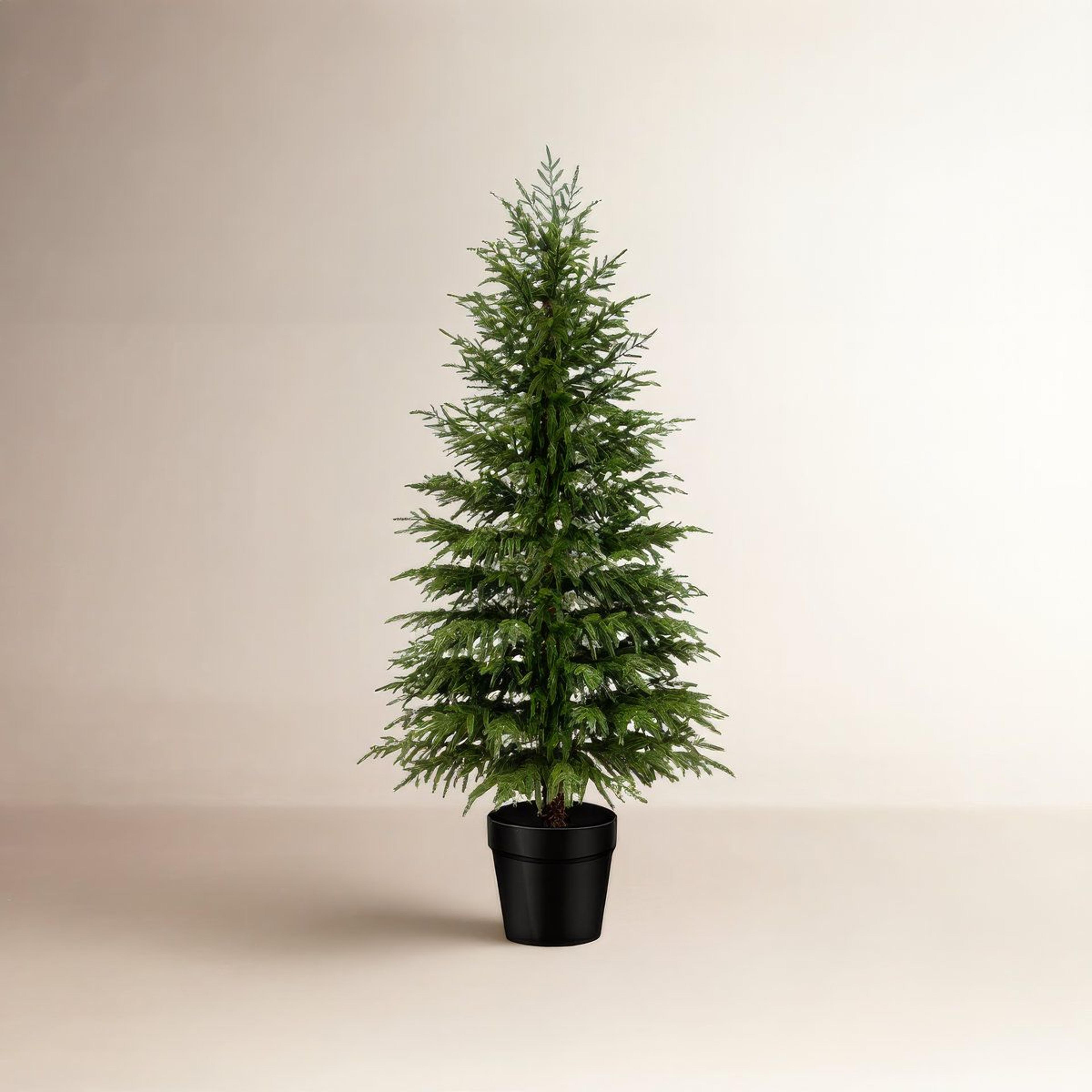 artificial pine christmas tree with lush green branches and potted stand