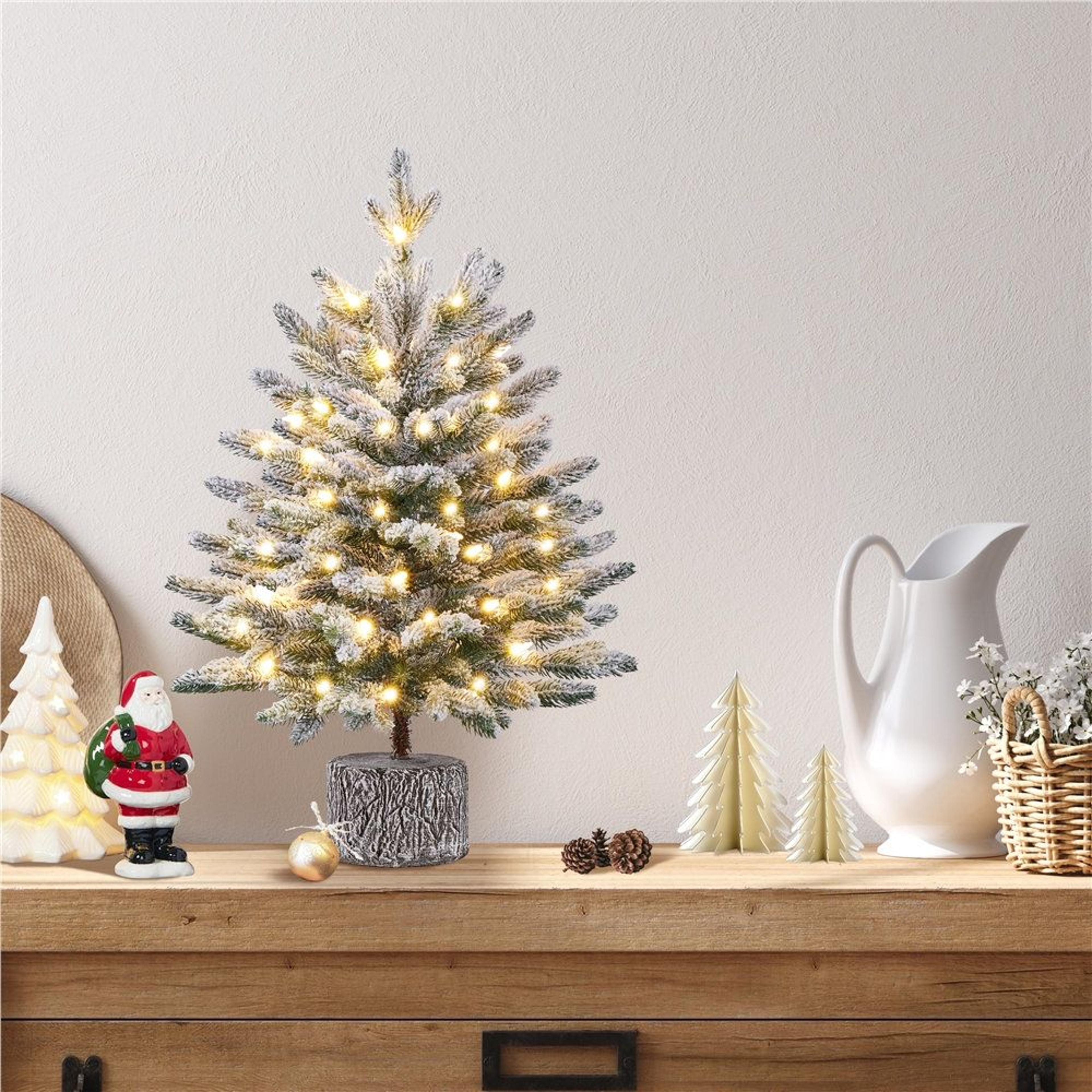 pre-lit flocked tabletop christmas tree with 35 warm led lights and potted stand