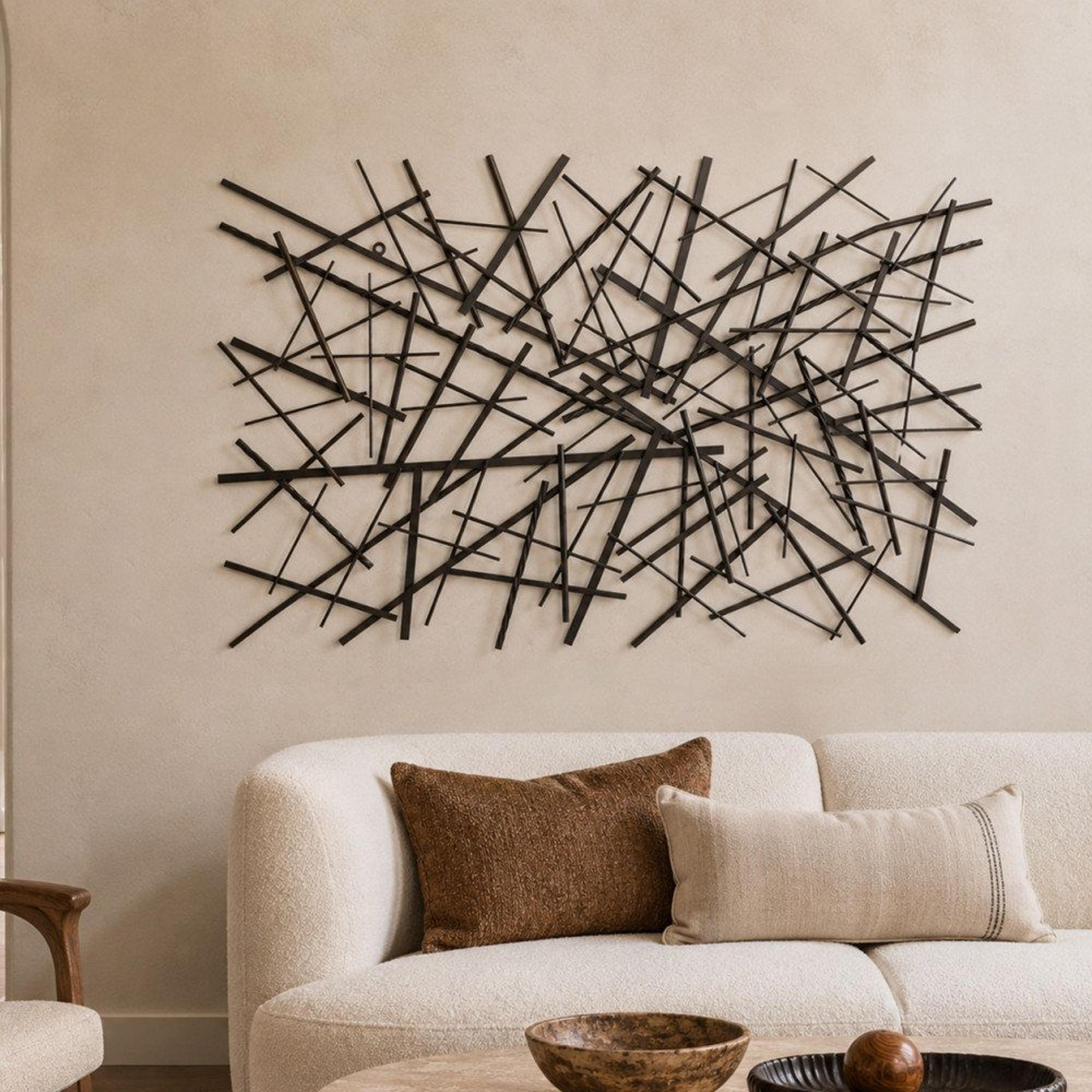 geometric metal wall art with overlapping lines in matte black