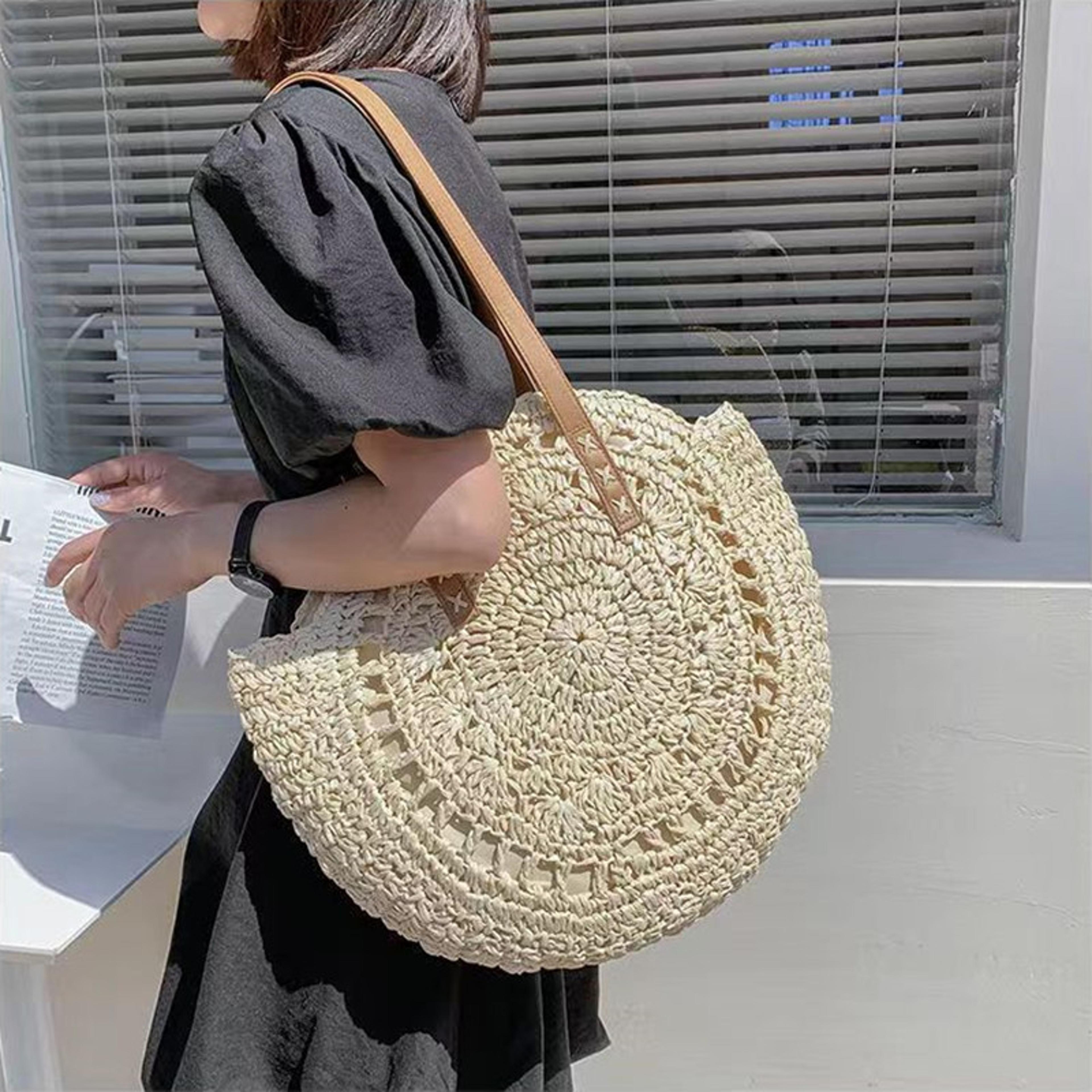 handmade round straw beach bag and vintage woven shoulder purse for summer vacation
