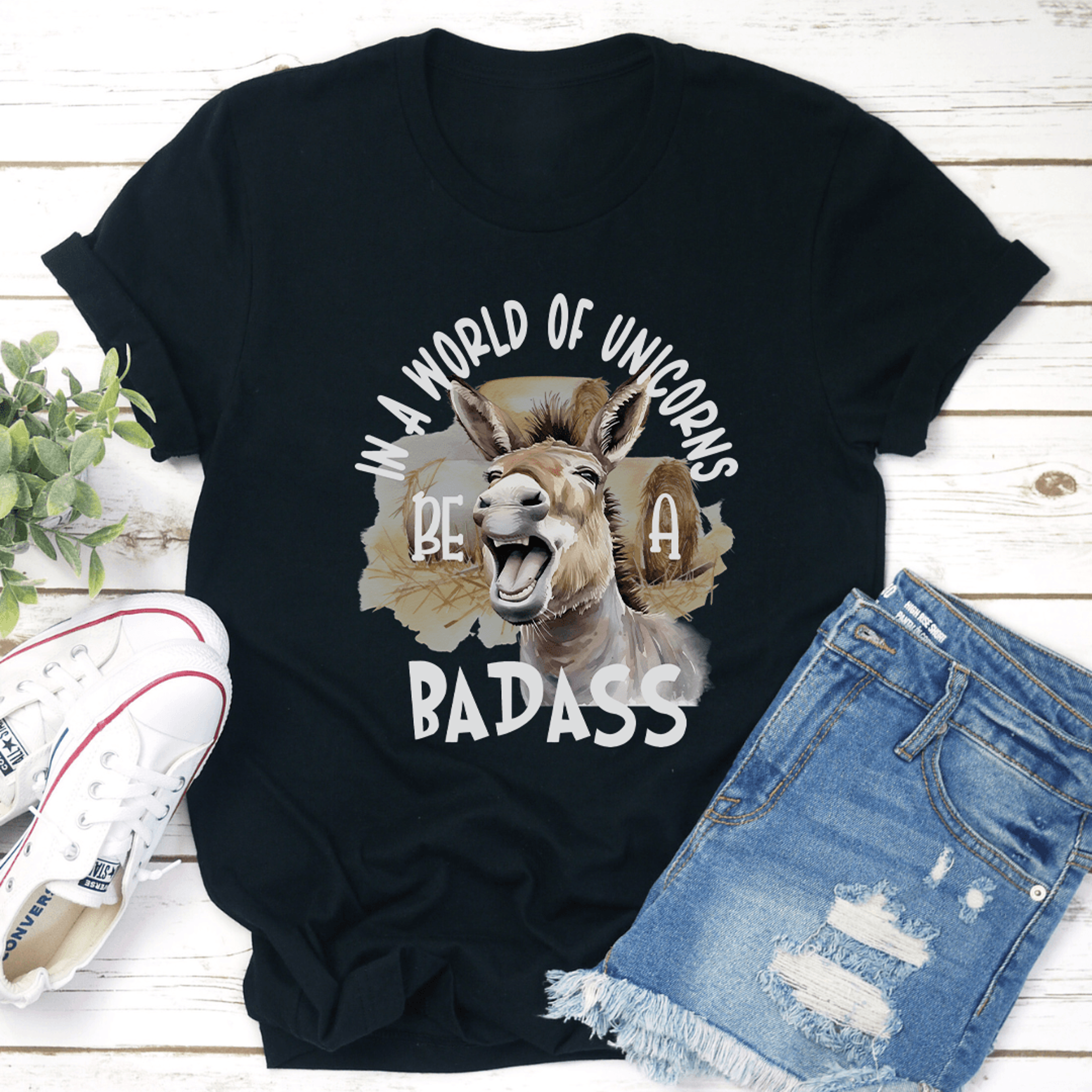 in a world of unicorns be a badass tee