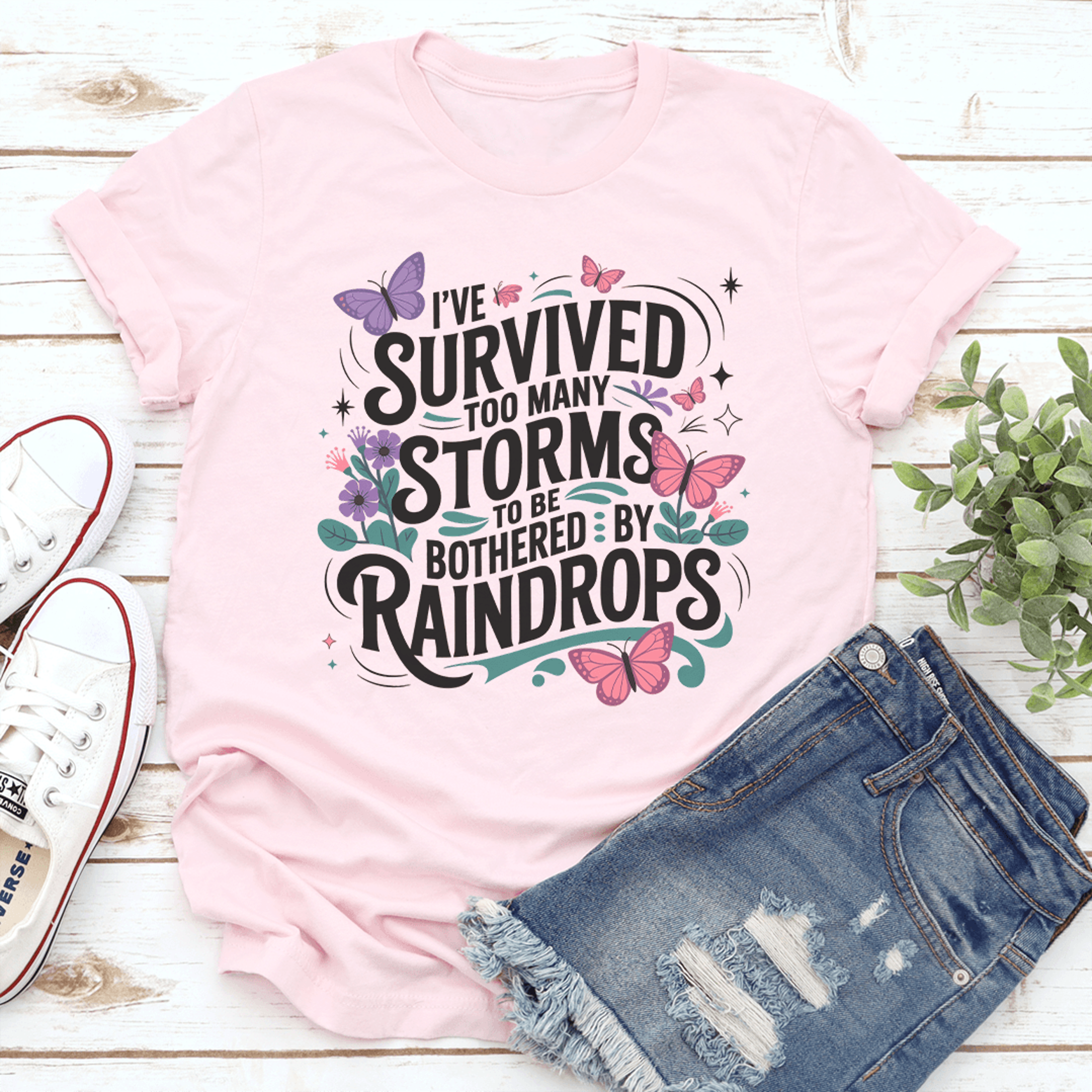 i've survived too many storms to be bothered by raindrops tee