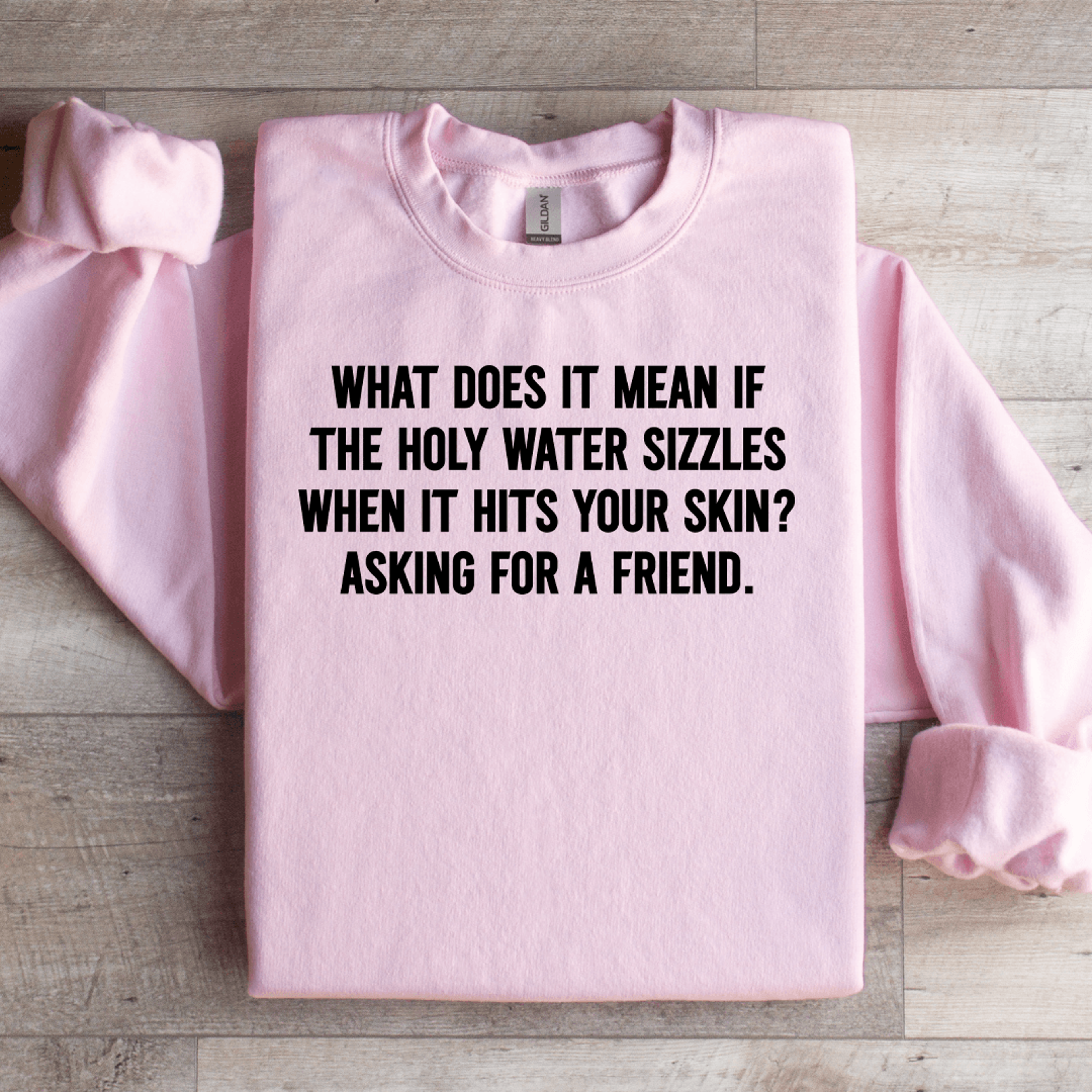 what does it mean if the holy water sizzles sweatshirt