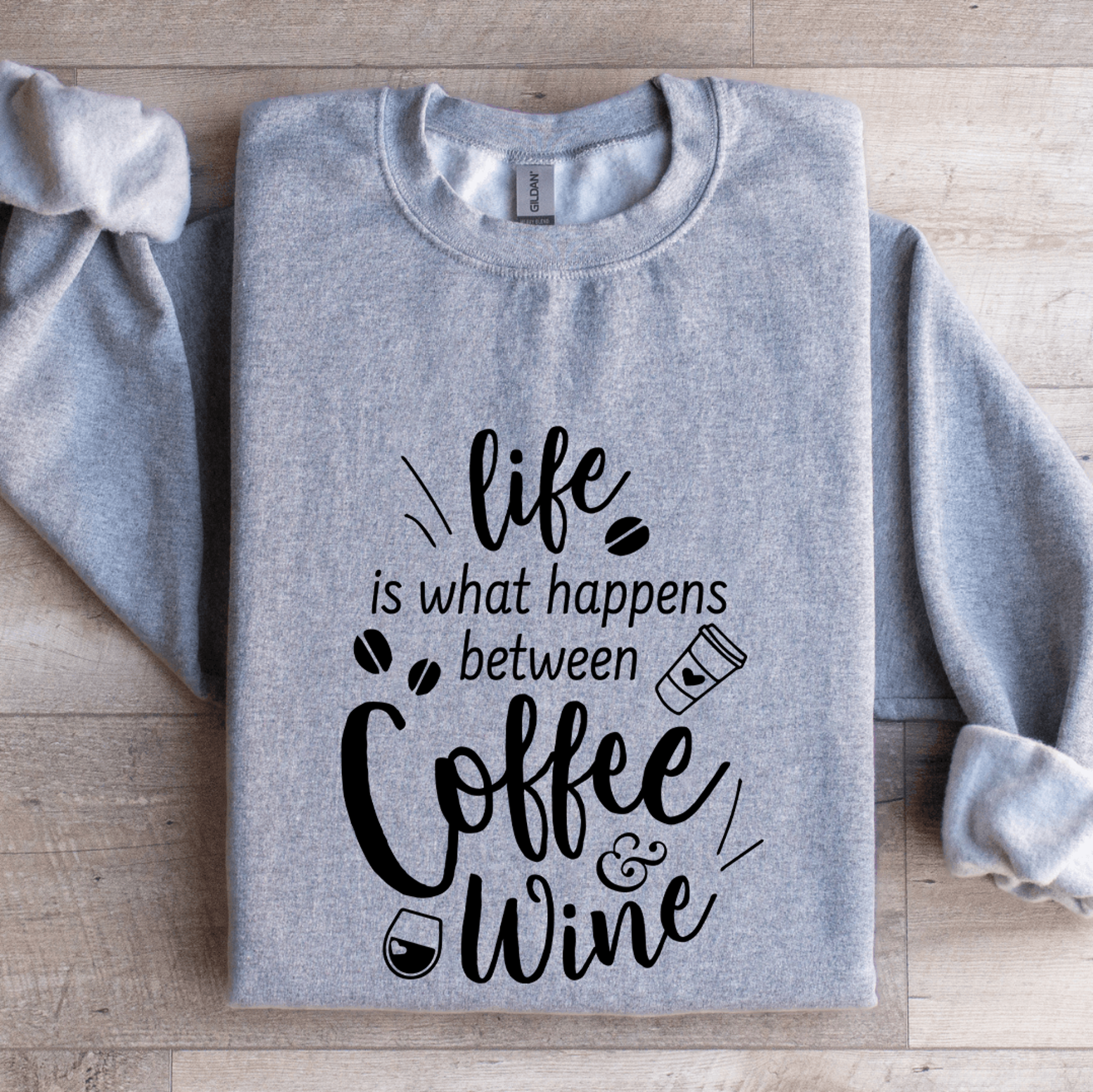life is what happens between coffee & wine sweatshirt
