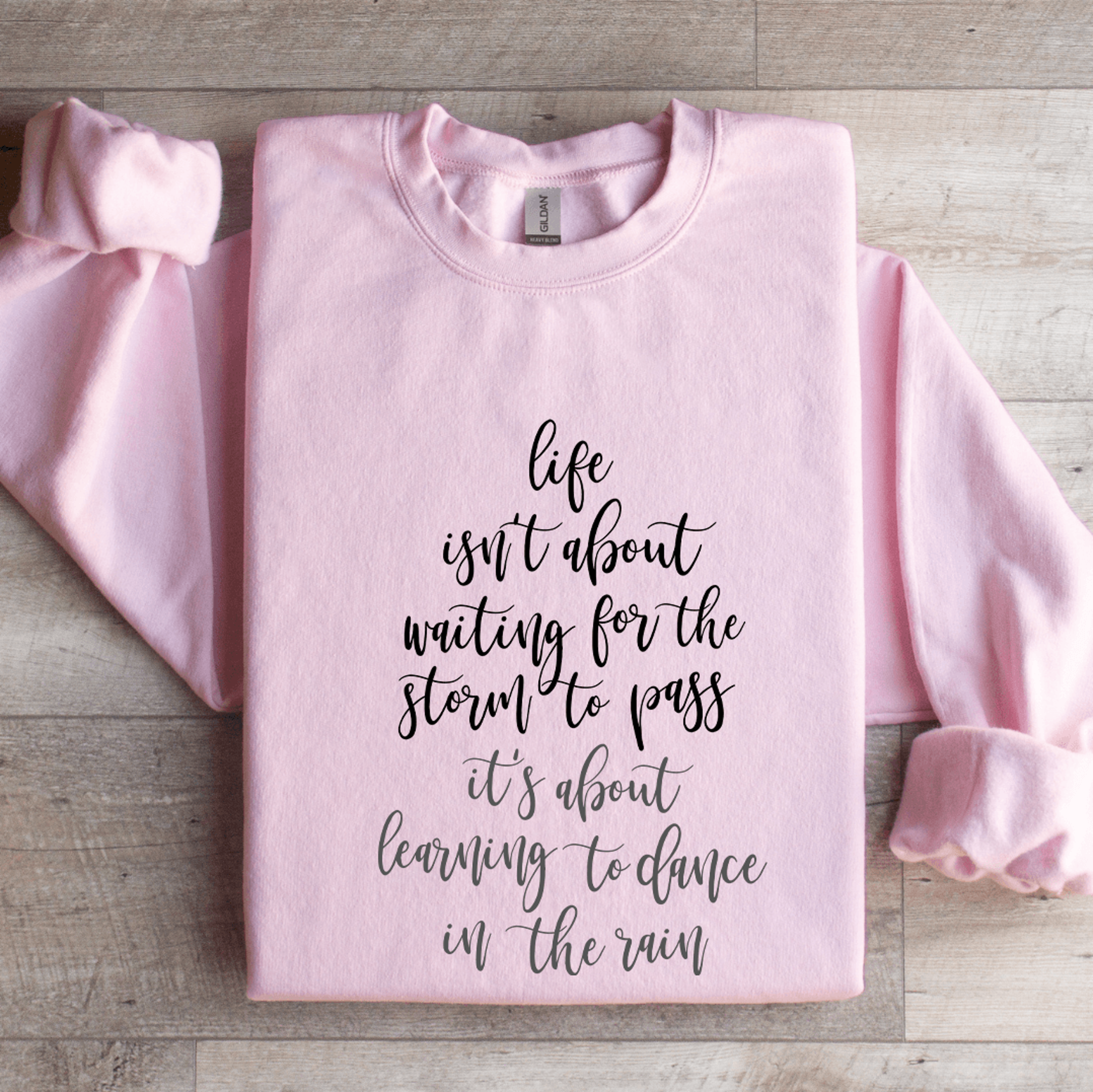 life isn't about waiting for the storm to pass sweatshirt